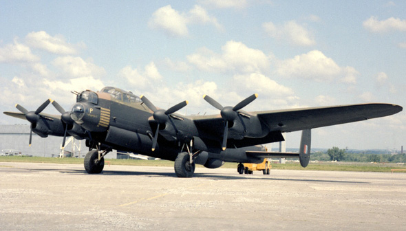 Avro 683 Lancaster X aircraft on the runway next to the museum