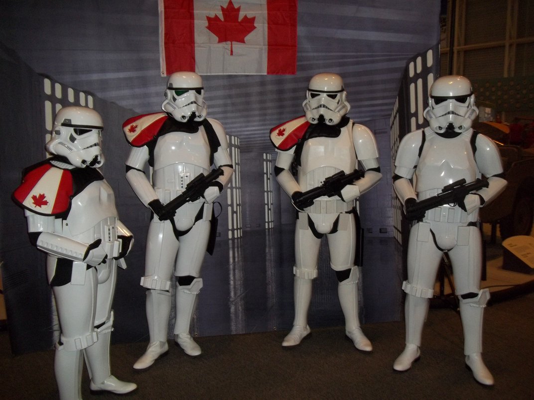 Four people dressed in Storm Trooper costumes