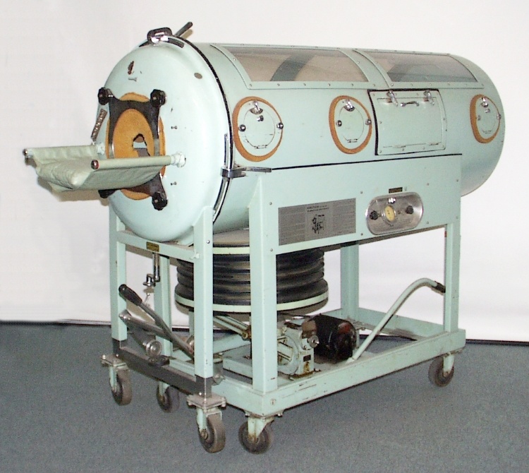 A metal, tube shaped machine with a chamber the size of a person, used to allow polio victims with paralyzed respiratory muscles to breathe.