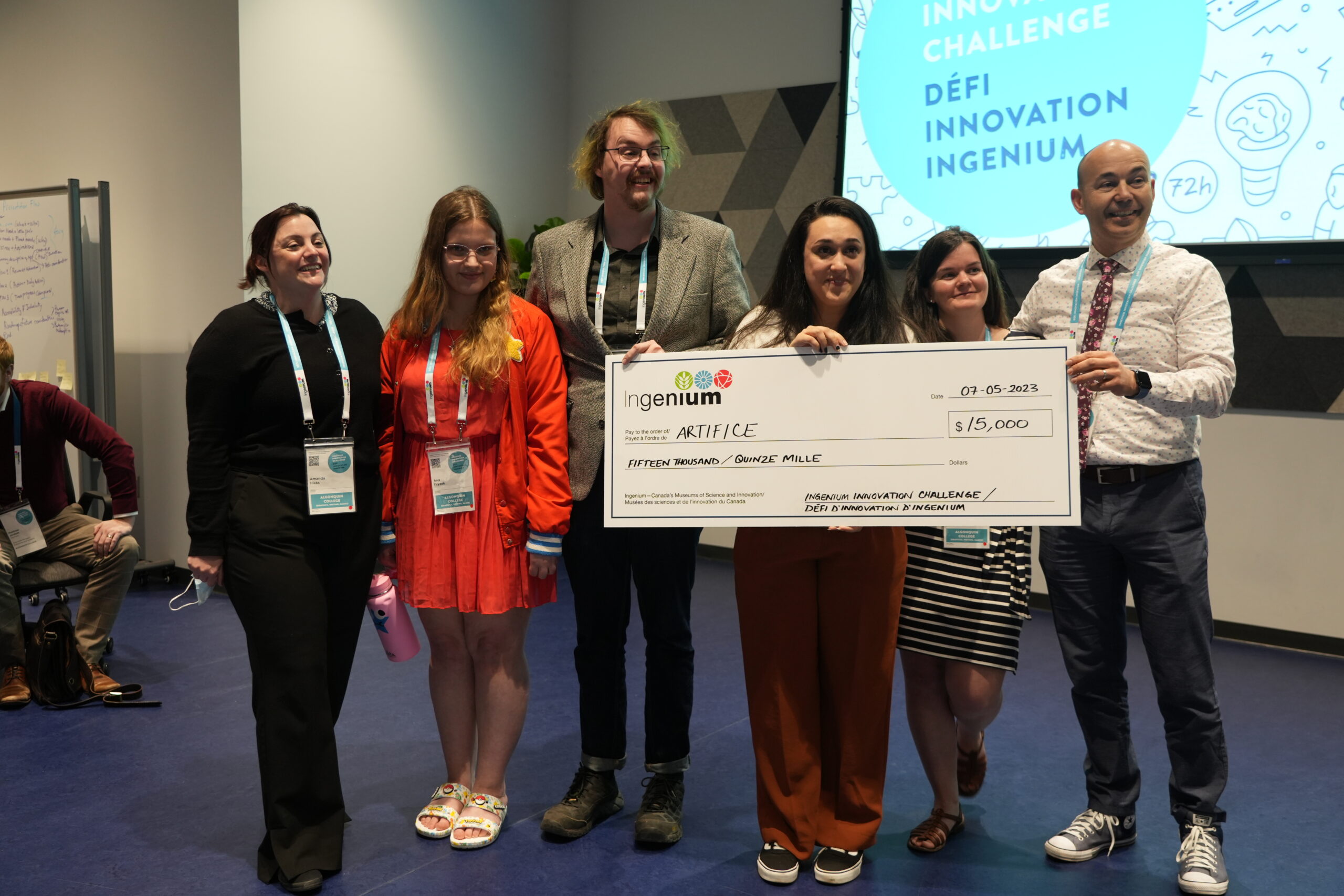 The six members of Artifice, the winning team of the inaugural Ingenium Innovation Challenge, stand with a check of the $15,000 cash prize.